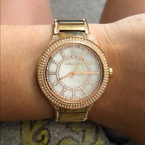 Rose gold with white face Michael Kors watch